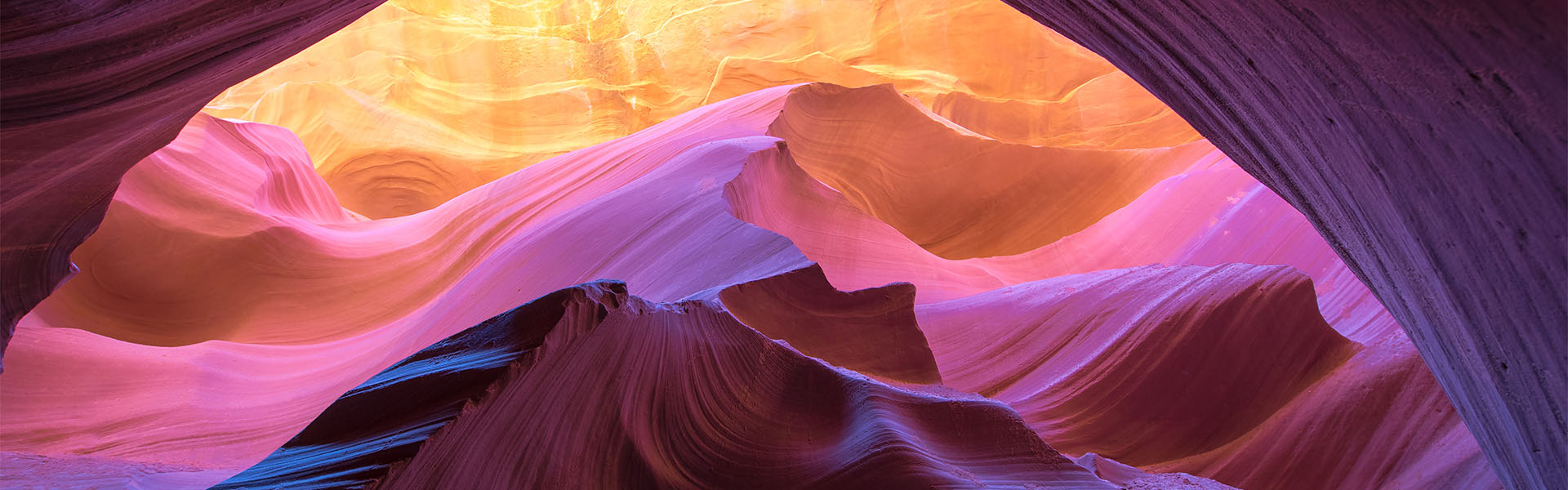 Light illuminating sculpted Antelope Canyon sandstone